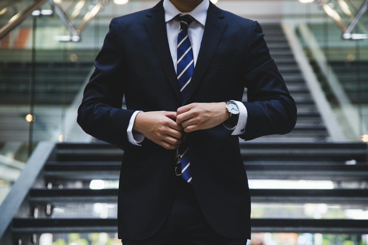 Man wearing a formal suit at an occasion