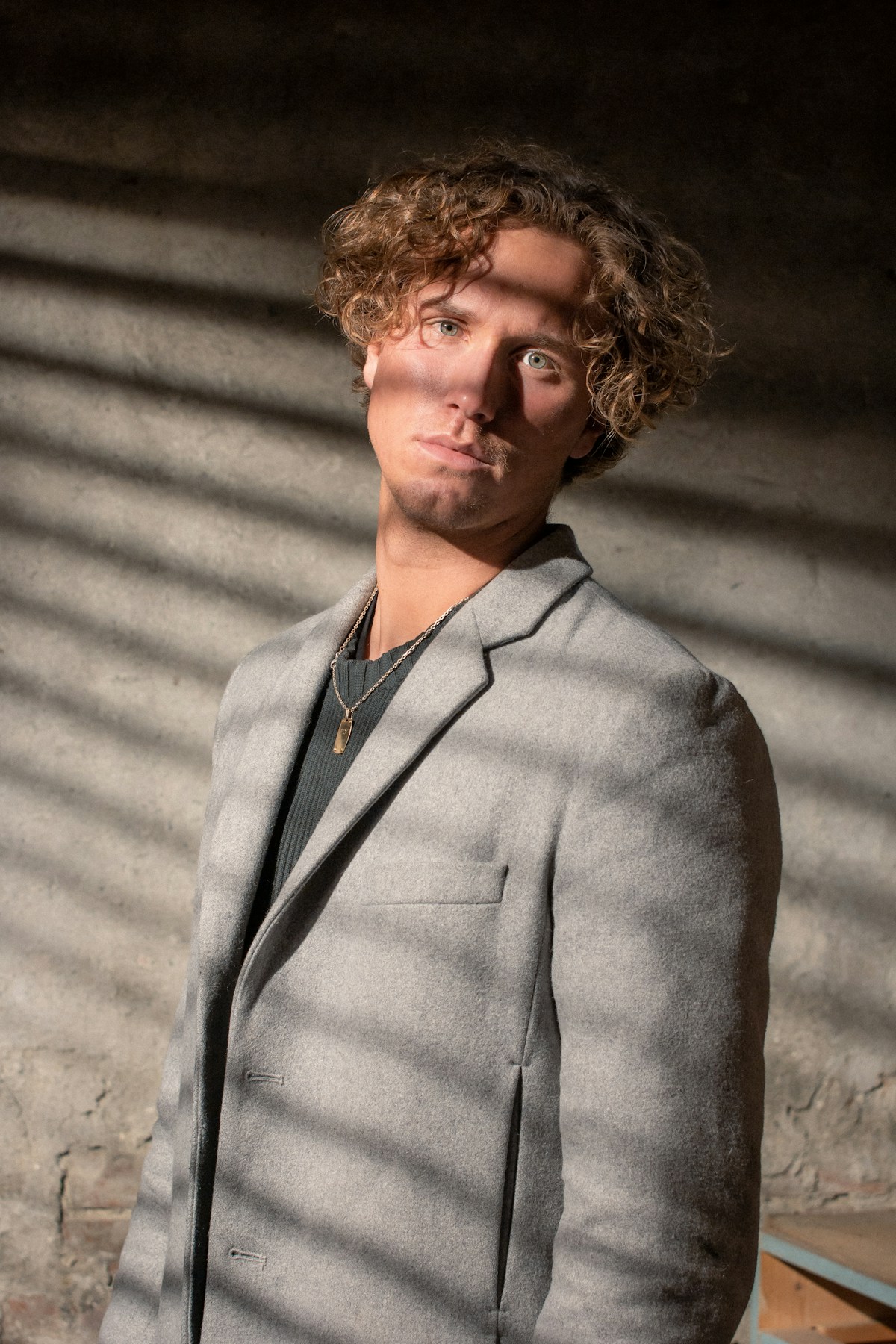 Tailor fitting a navy suit